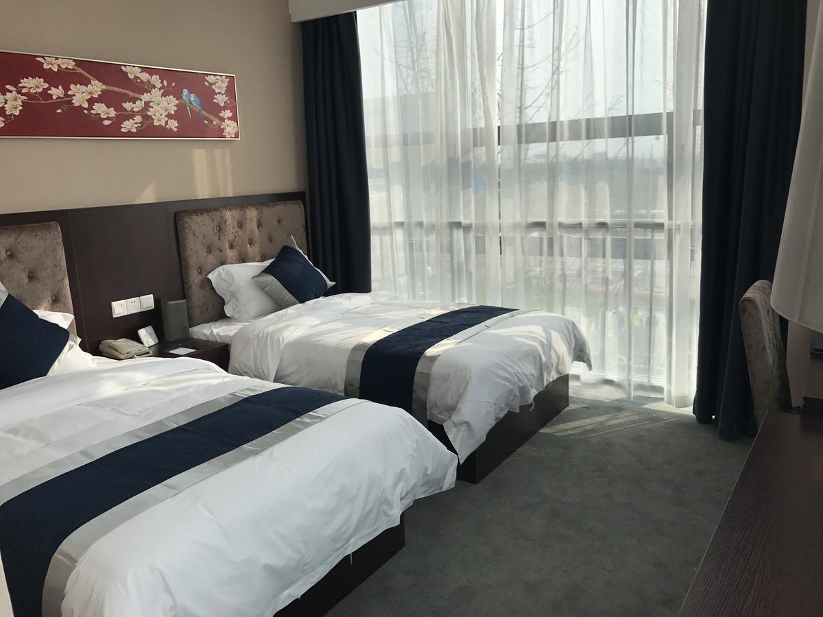 Hubei Airport Business Hotel Tianhe Airport Branch Ухань Екстер'єр фото